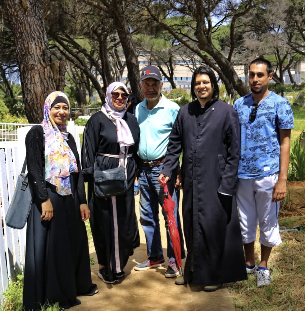 Clean-up initiative at Muslim cemetery sees young and old gather to clean gravesites